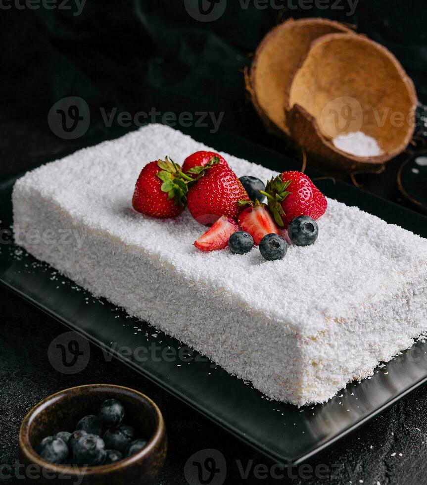 raffaello cake coconut almond cake with berries photo