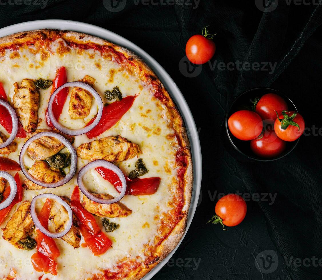 Fresh barbecue chicken pizza with vegetables photo