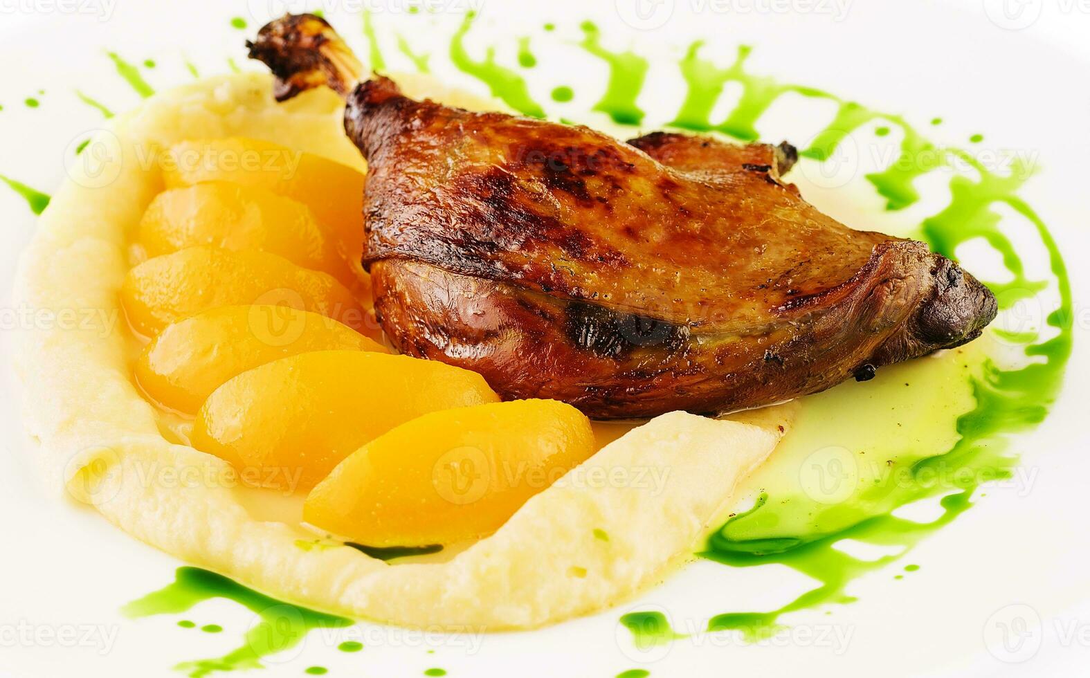 duck leg confit with mashed potatoes photo
