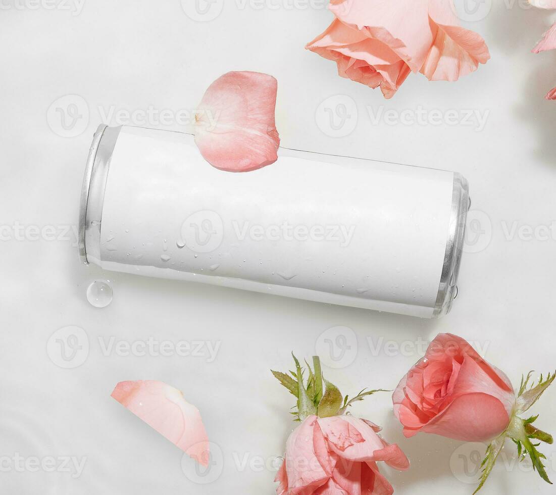 Wet metal aluminum beverage drink can with rose petals photo