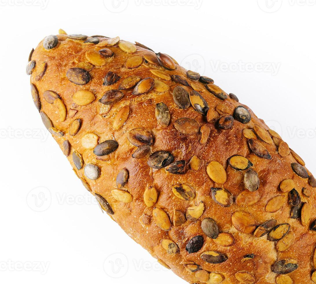 Bread with pumpkin seeds isolated on a white photo