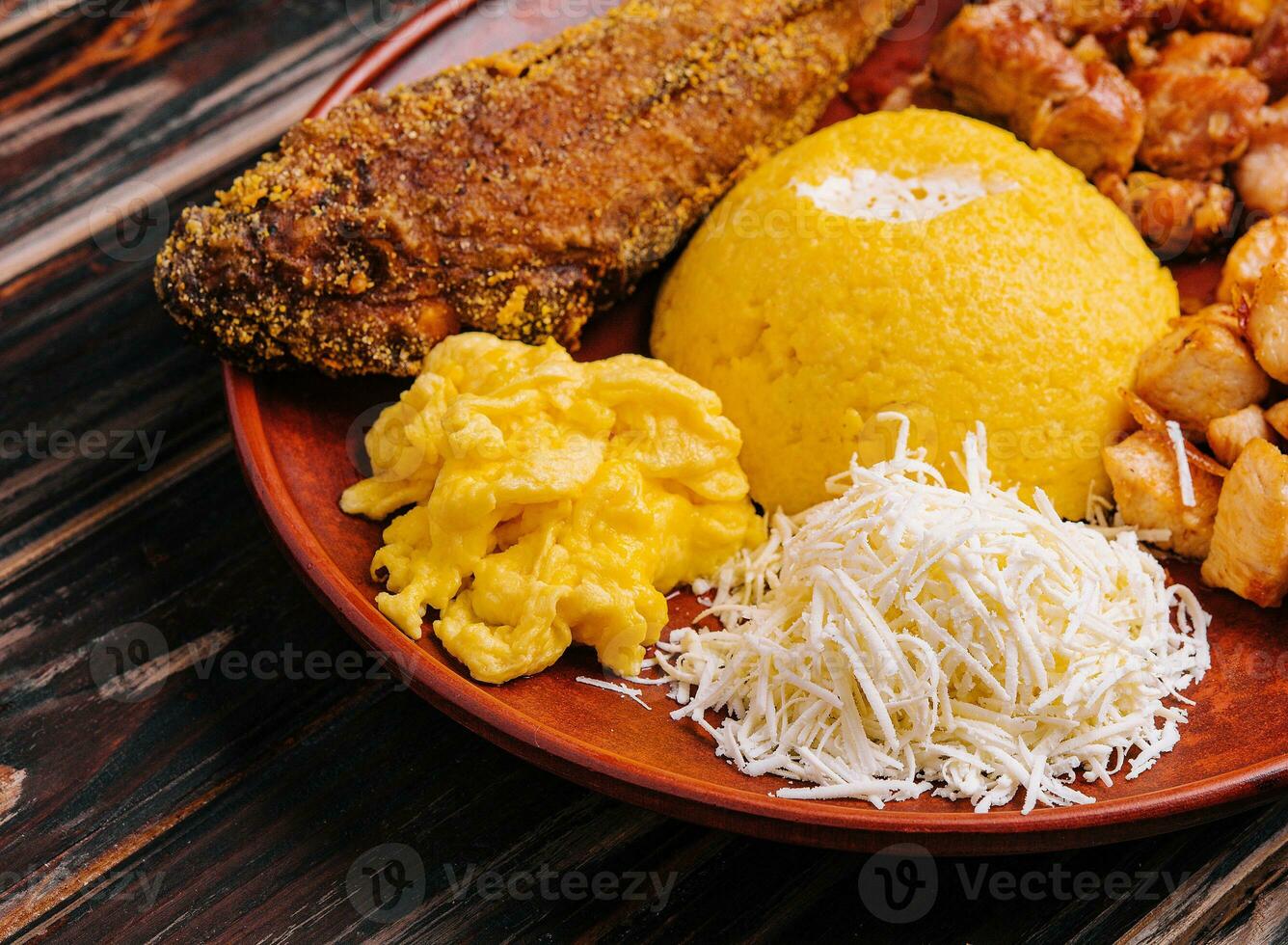 Traditional Moldavian hominy porridge on on a ceramic plate photo