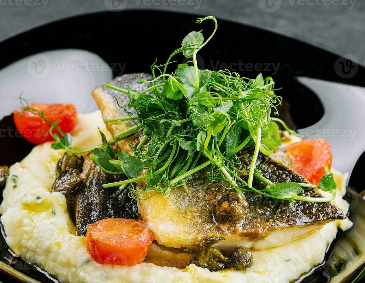 Fried norwegian skrei cod fish filet with mashed potatoes photo