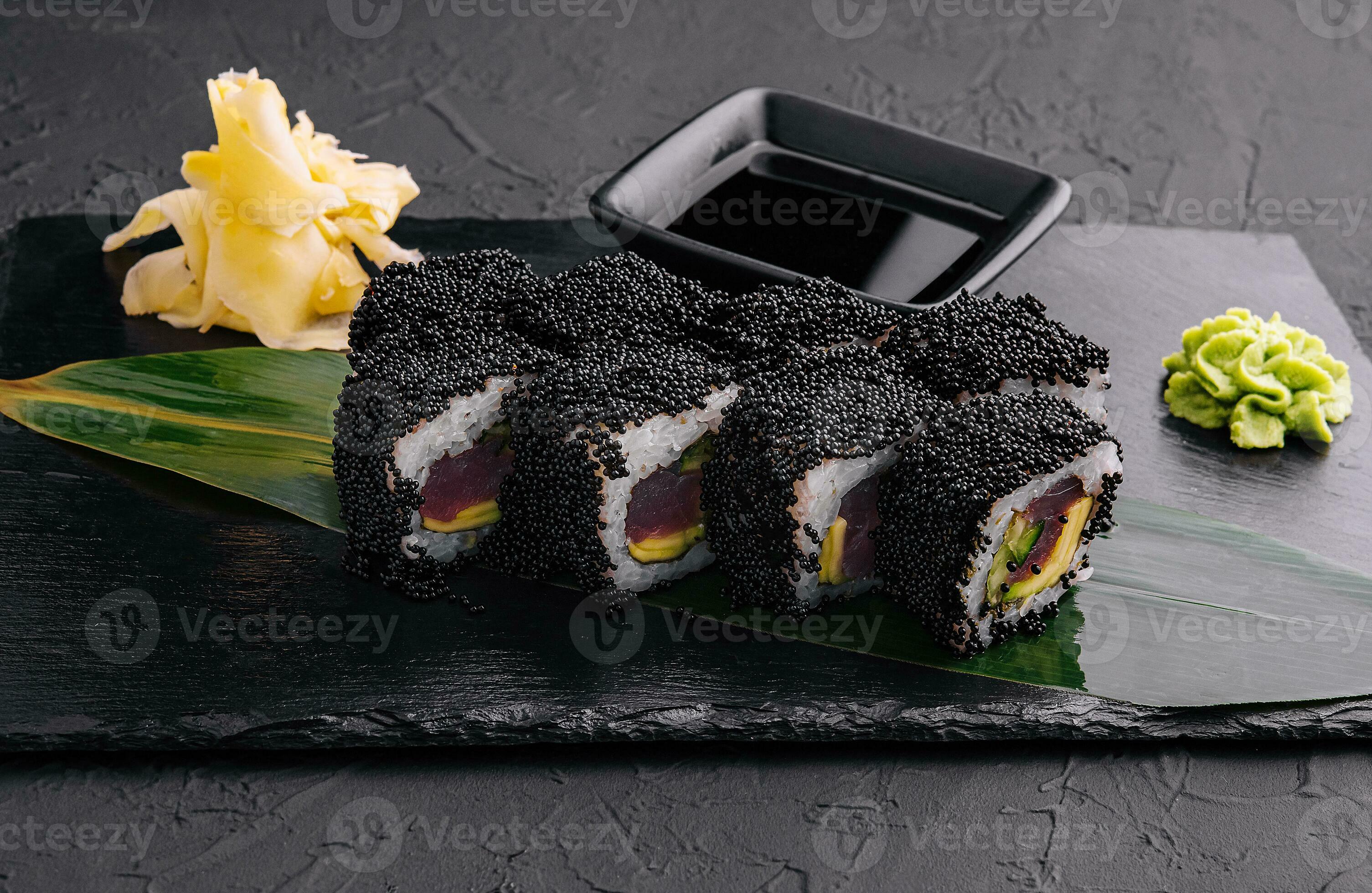 california rolls covered black tobiko on a black board 31755057 Stock ...