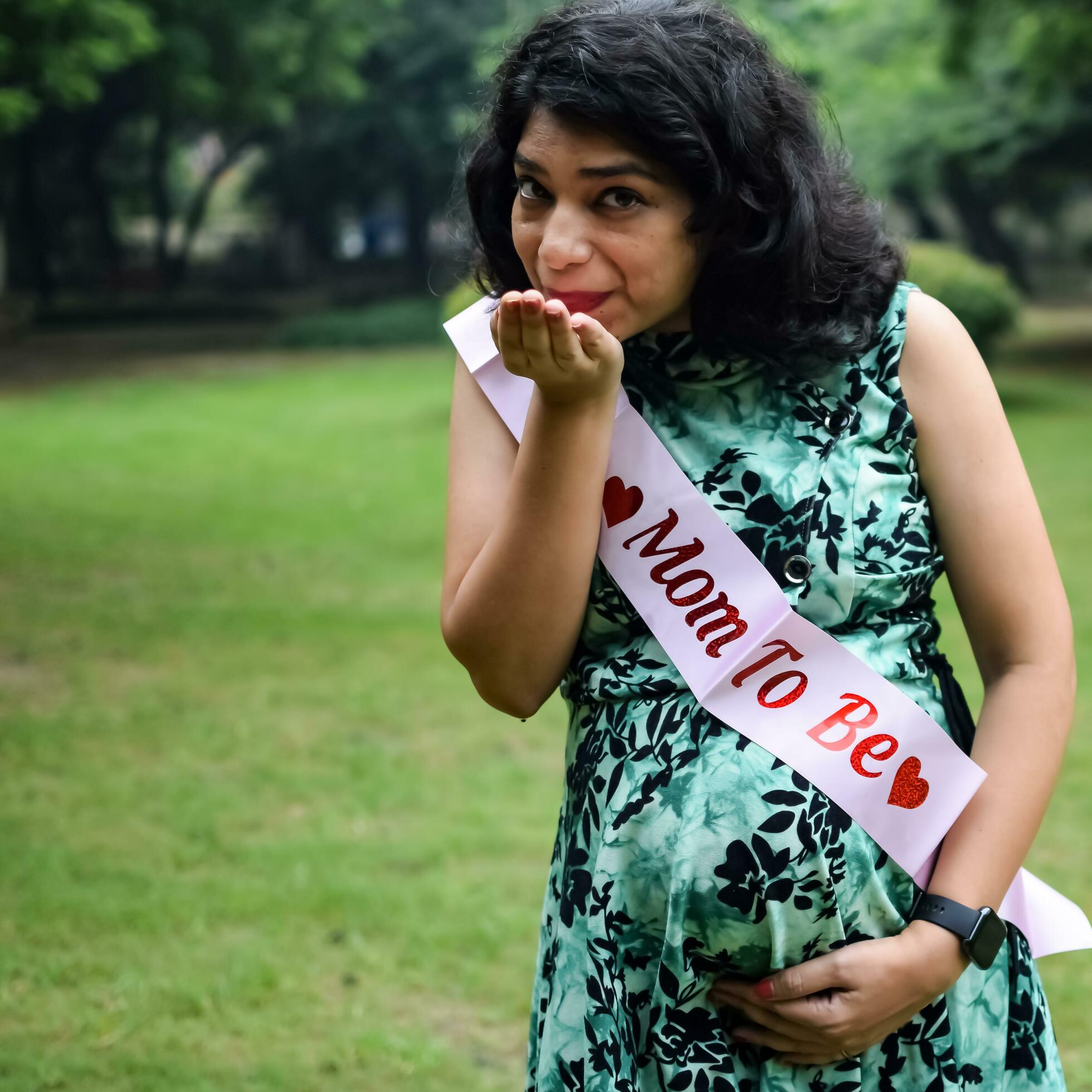 A pregnant Indian lady poses for outdoor pregnancy shoot and hands on  belly, Indian pregnant woman puts her hand on her stomach with a maternity  dress at society park, Pregnant outside maternity shoot 31757764 Stock  Photo at Vecteezy