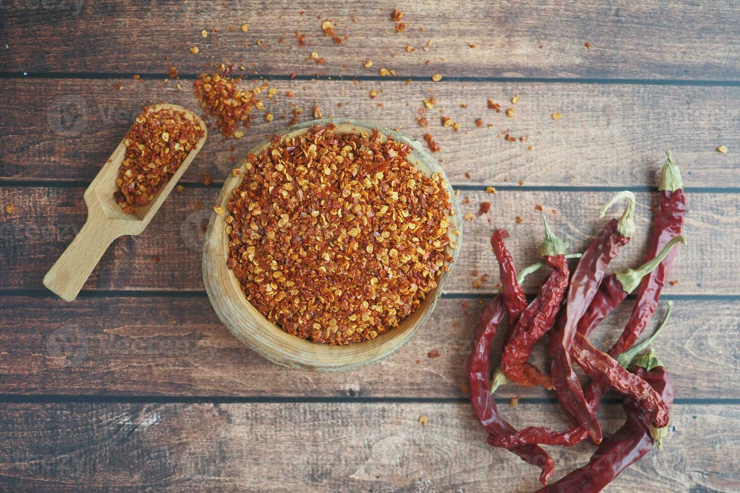 chili flakes in a bowl on table photo