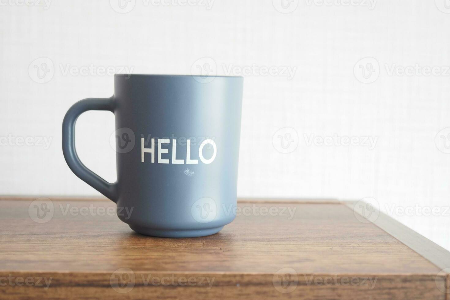blue coffee cup with hello word photo