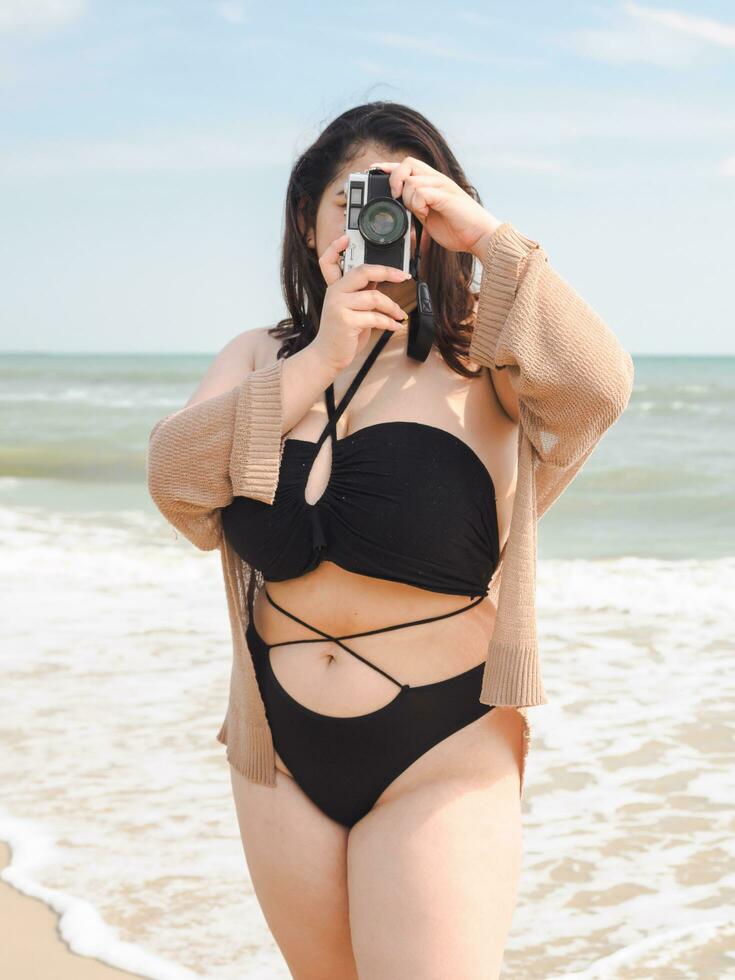 Portrait young woman asian chubby cute beautiful oneperson in bikini black sexy front viewpoint tropical sea beach white sand clean and bluesky background calm Nature ocean Beautiful wave water travel photo