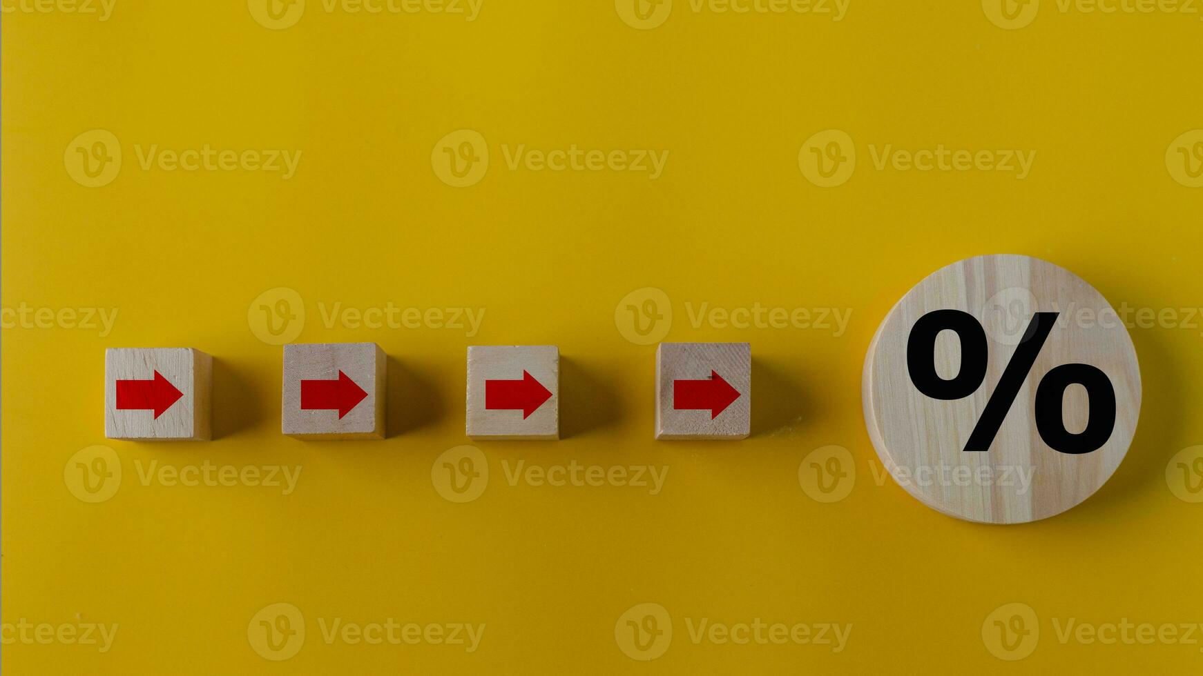Percent and upwards increasing arrows on wooden cubes. Financial interest mortgage rates increase or price commission raise concept. photo