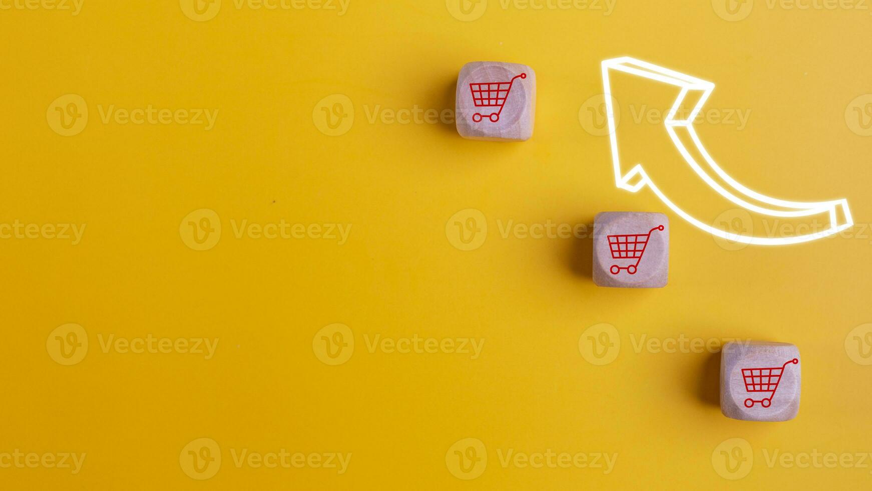 Wooden cubes with shopping cart icons and increasing trend-up graph. Increase higher sale volume and shopping trolley cart for online e-commerce business and internet marketing strategy concept. photo