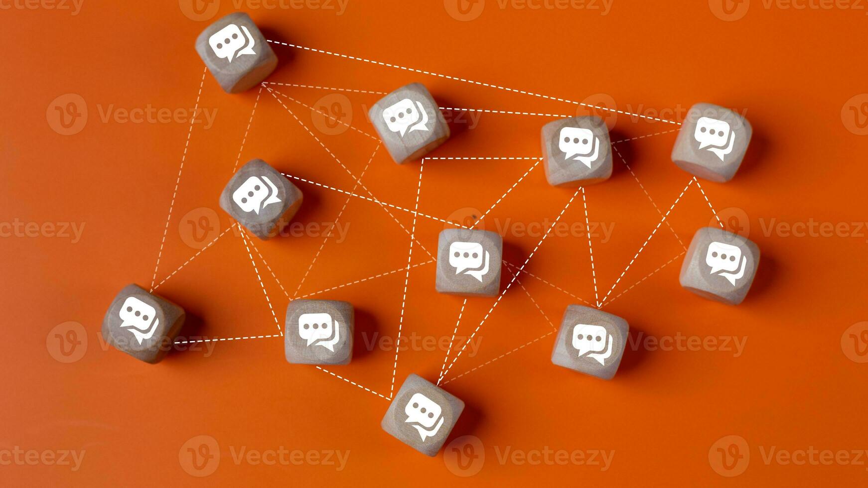 Concept of online communication or social networking. Wooden cubes with speech bubbles linked to each other with lines. photo