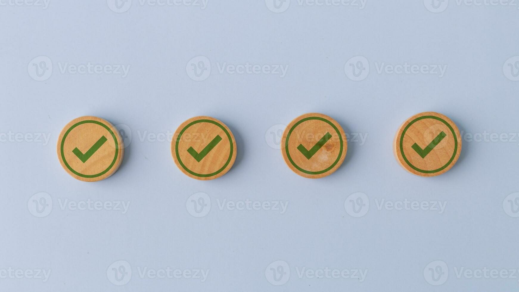 Check mark guarantee correct icons on wooden cubes on background, International Organization for Standardization ISO and quality control certification concept, Sign of top service quality assurance photo