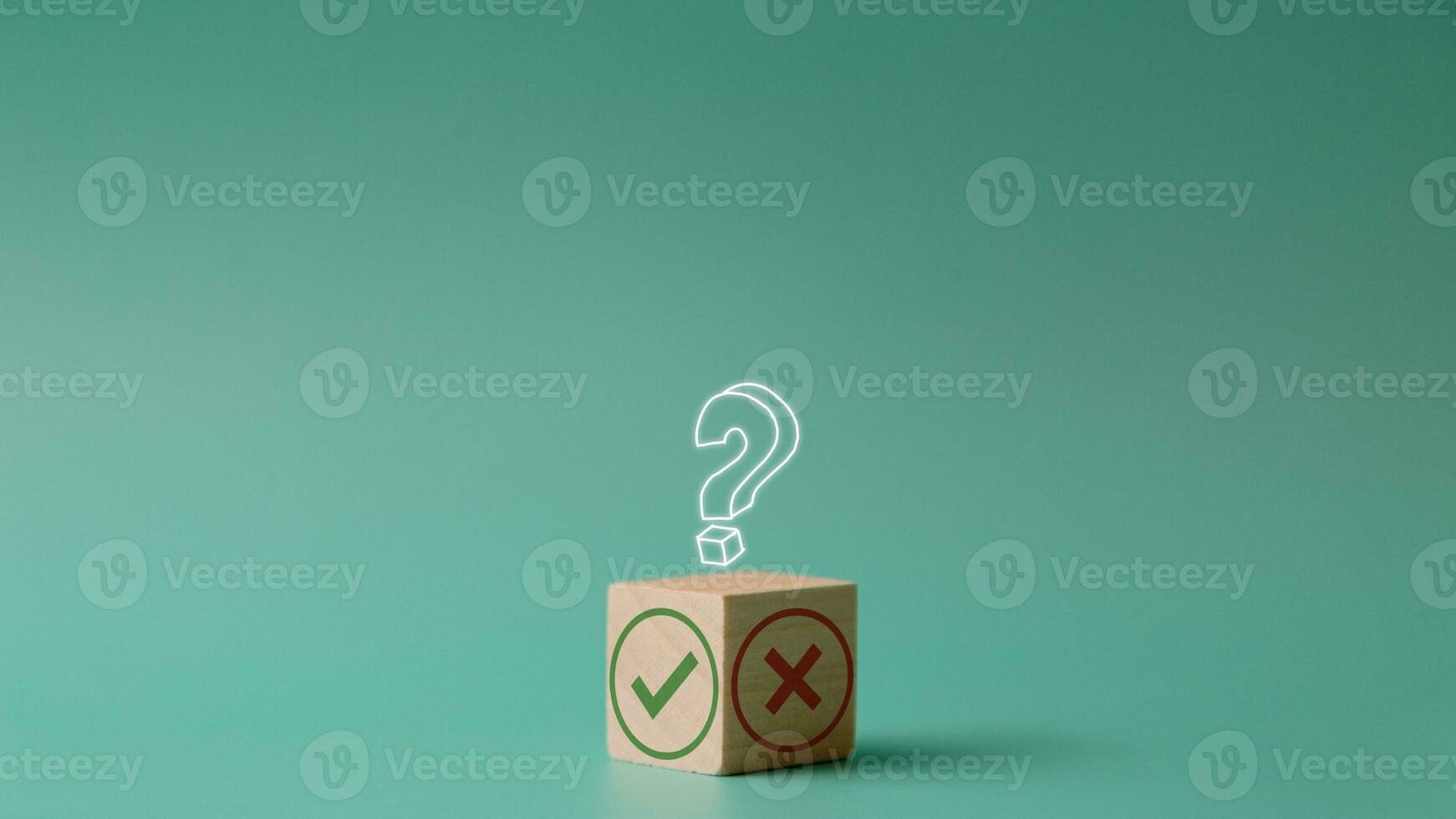 Tick mark and cross mark on a wooden cube. the decision between Yes or No choice symbol for approval or rejection. Change or choose a method or business strategy concept. Copy space with question mark photo