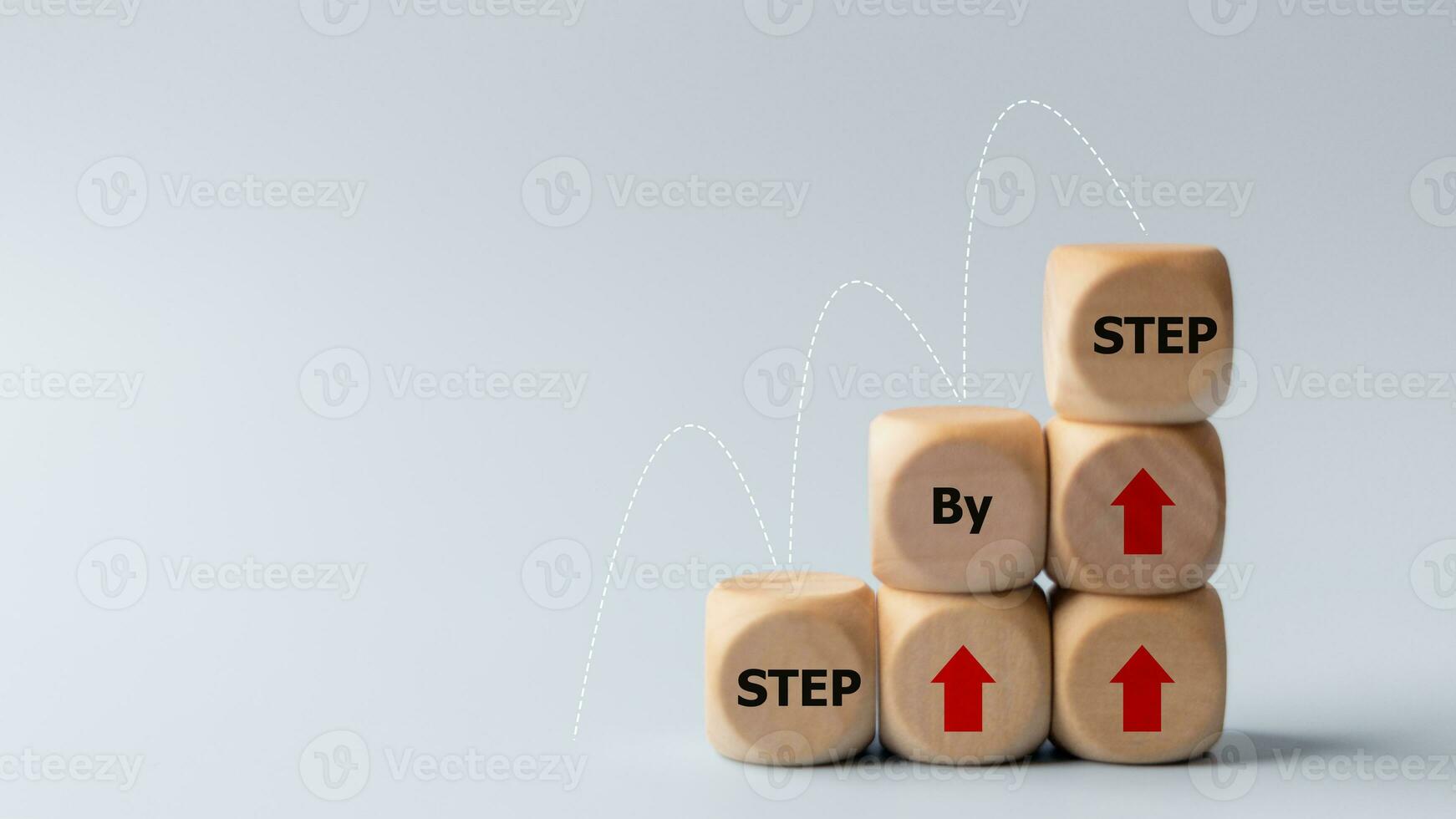 Business concept image with wooden cubes word step by step on wooden cubes. Achievement or progress in business career. photo