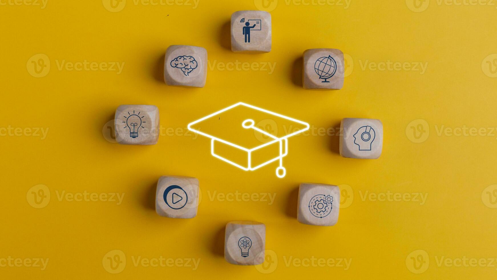 Knowledge and teaching. Wooden cubes with graduation and education symbols. Success and necessary skills in graduation or education. photo