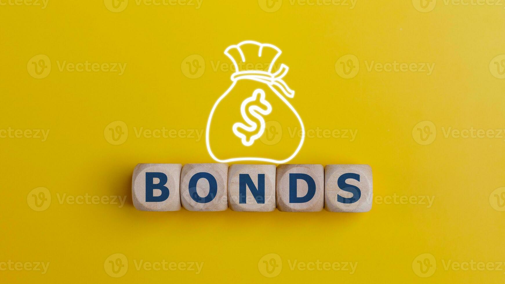 BONDS word on wooden cubes with money bag on yellow background. Bonds increasing concept. photo