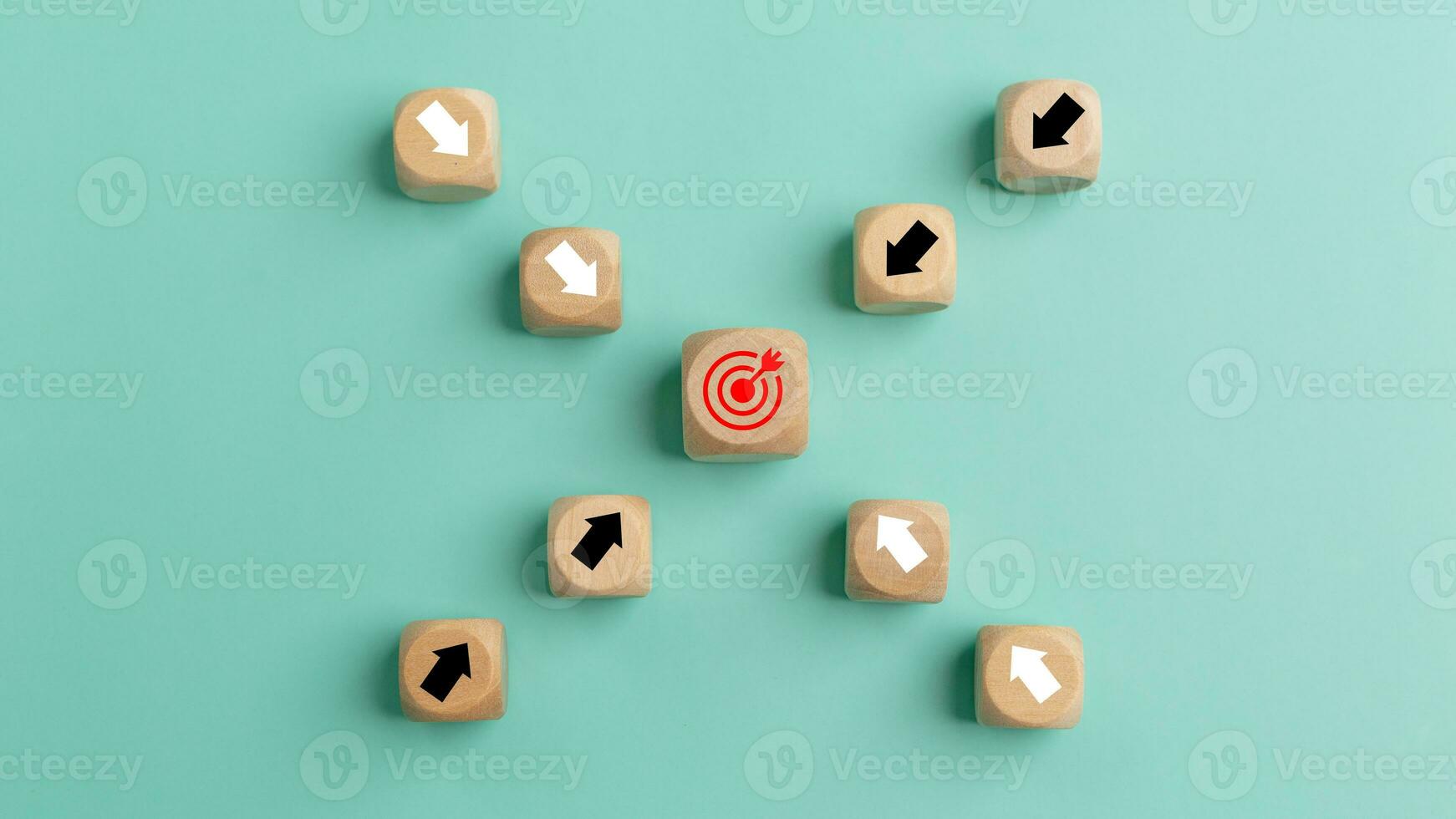 Wooden blocks with arrow and target on green background. Success concept. Business achievement goal and objective target concept. photo