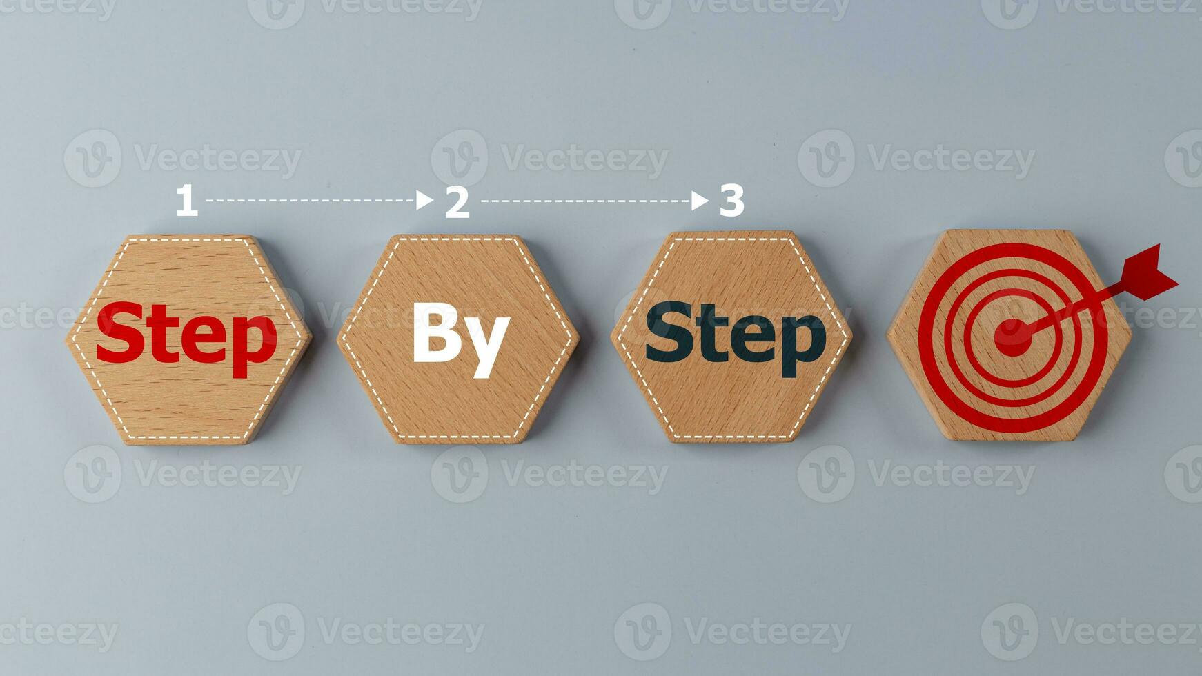 Step-by-step concept. Business concept image with wooden cubes word step by step on wooden cubes. Achievement or progress in business career. photo