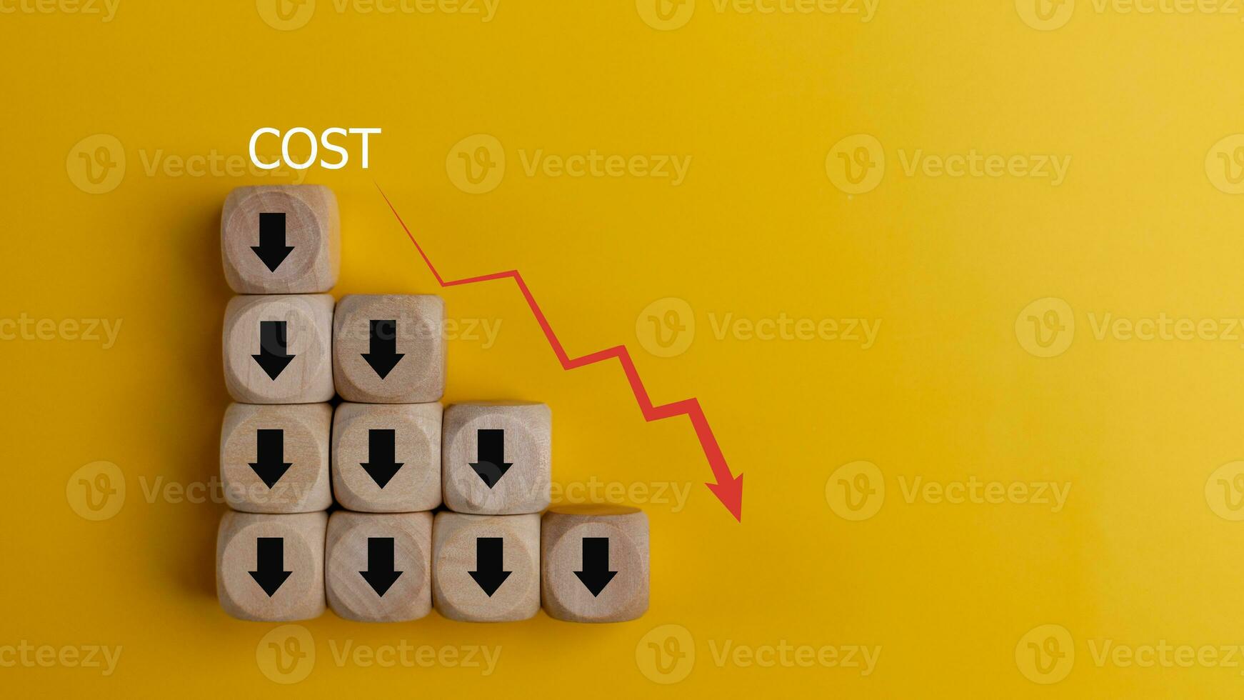 Lean or Cost reduction concept. Optimize manufacturing management. Decreasing company expenses to maximize profits. wooden cube with the words cost and red down arrows. Business improvement. photo