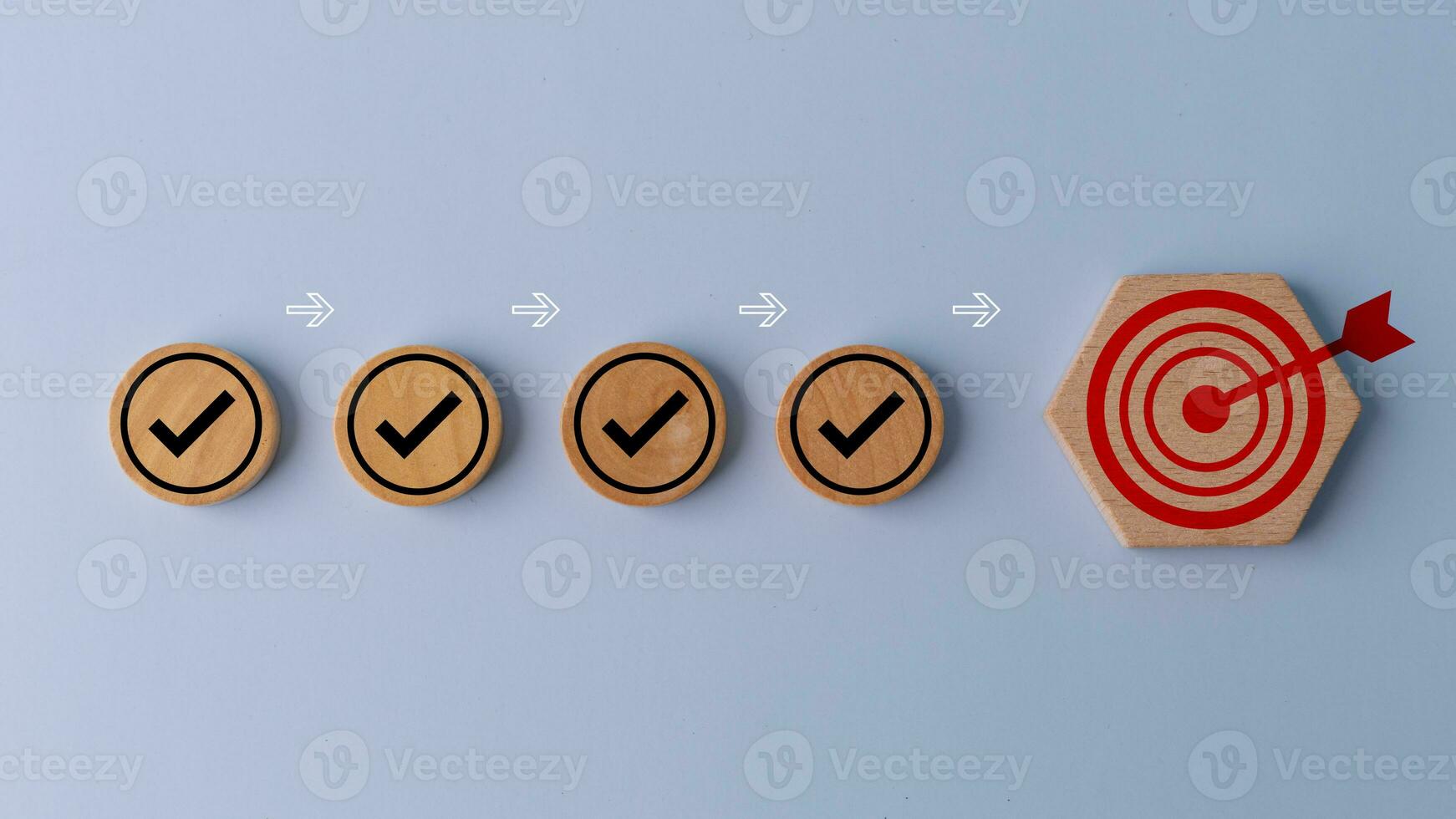 Check mark and target goals dartboard on wooden. Checklist, Task list, Survey and assessment, Quality Control, Goals achievement, and business success. To-do lists for achieving the target. photo