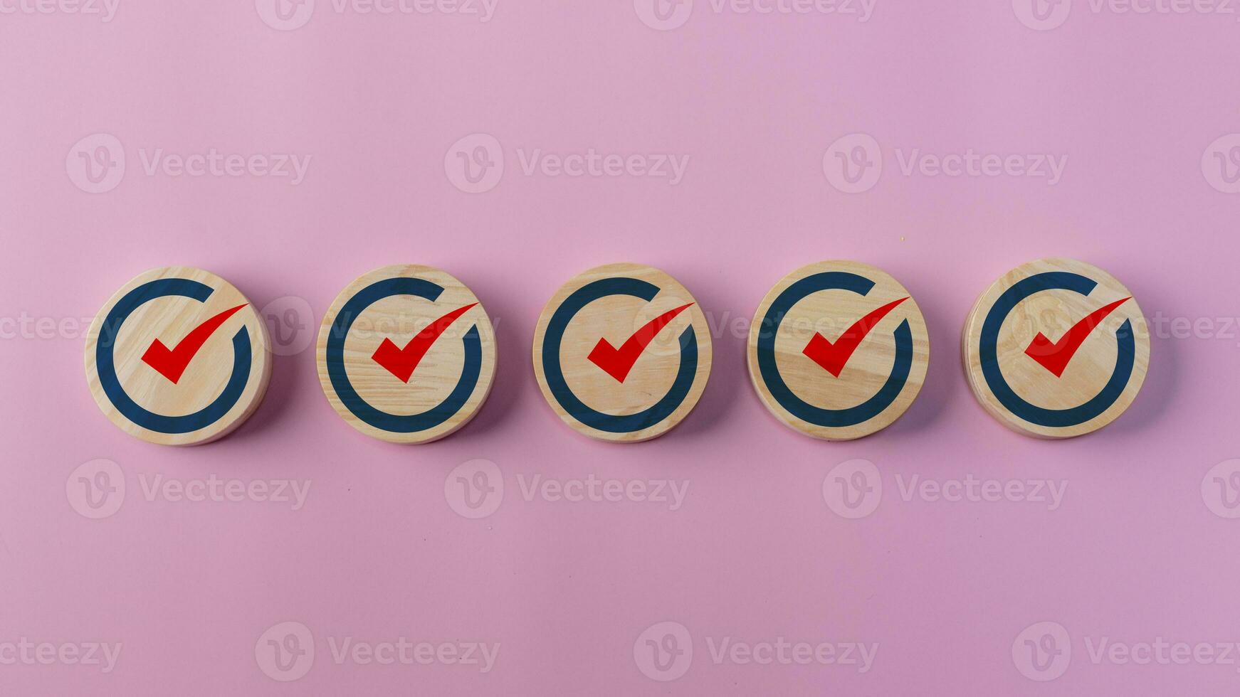 Check mark icon on wooden blocks. Checklists, Reminder Apps, Task lists, Surveys, assessment online forms. Goals achievement and business success. Company objective achievement and business success. photo