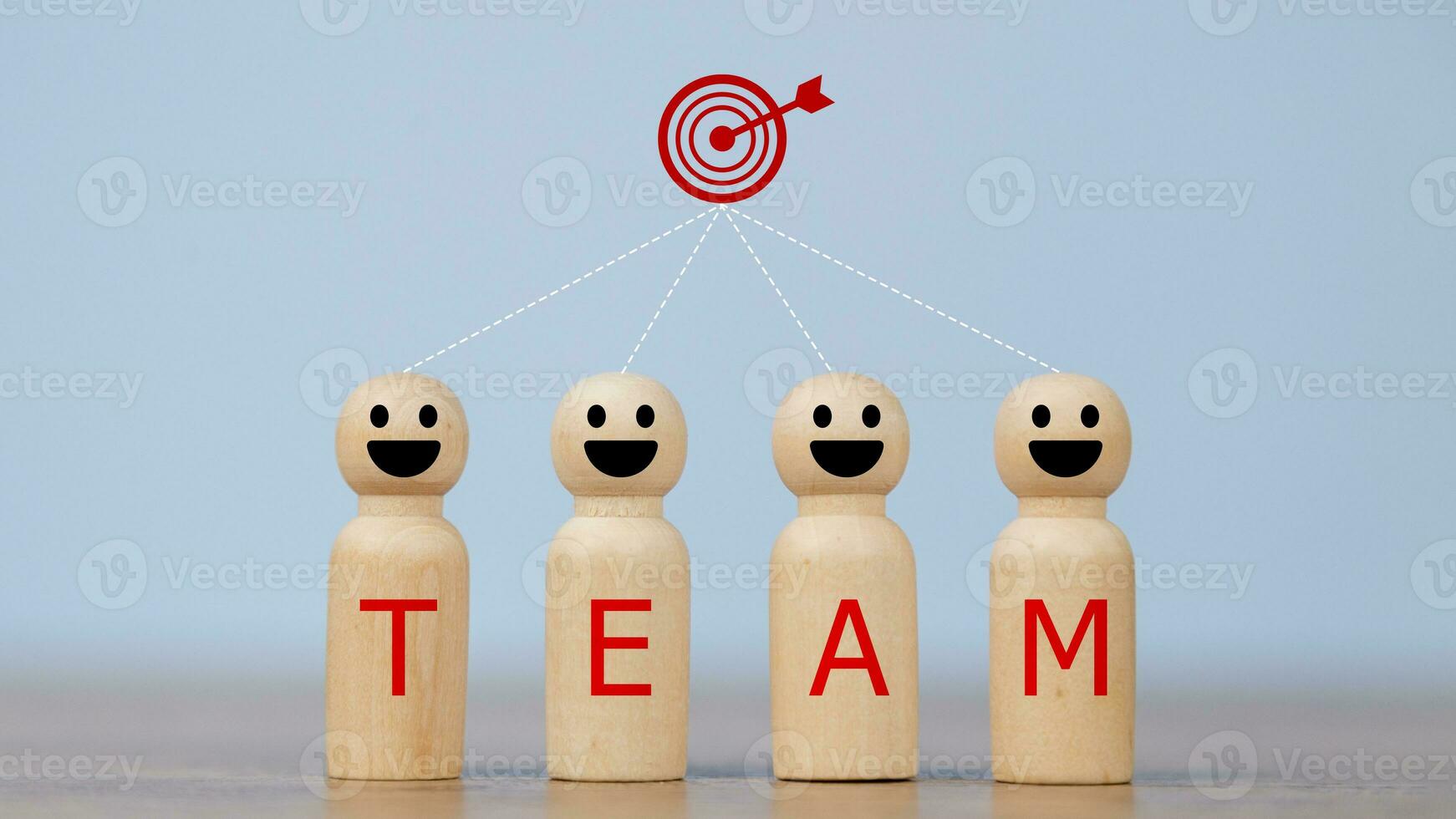 Wooden figures smile faces with team wording on the body and target icons. Teamwork and Ideas for business corporation concept. Business target and team concept. photo