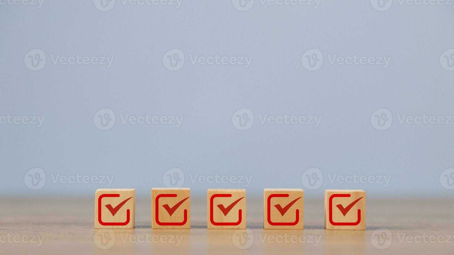 Checklist, Check mark icons for the jobs list on the wooden blocks. Task lists, Surveys, Assessments, Lists, Confirm items, Quality Control goals achievement of business success. photo