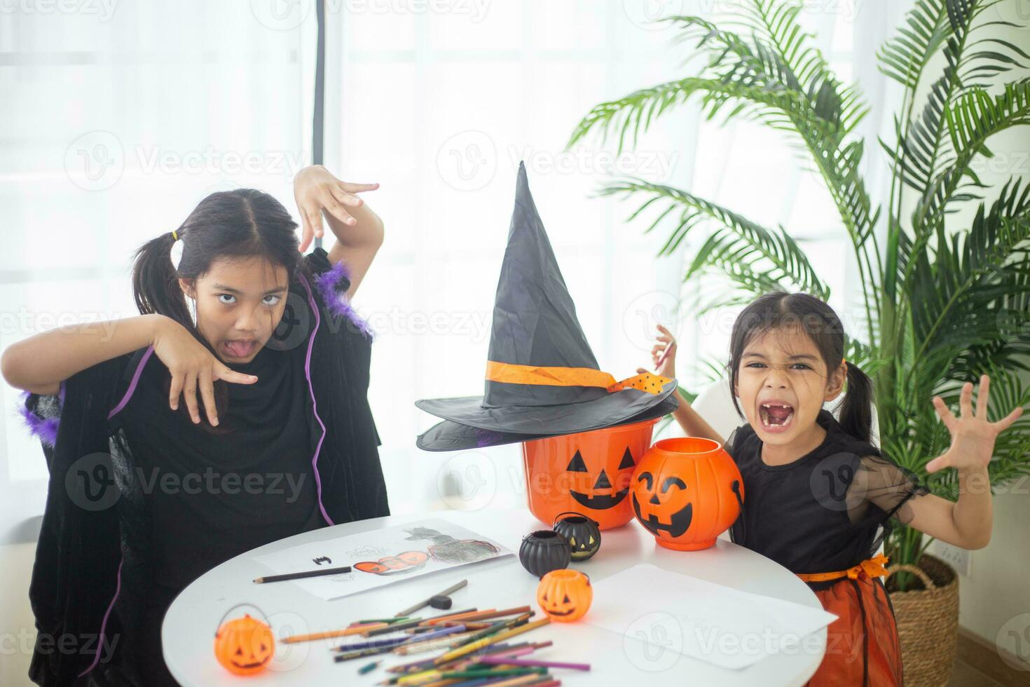 Happy Asian child girl in a witch costume to Halloween. trick or treat. Kids trick or treating. photo