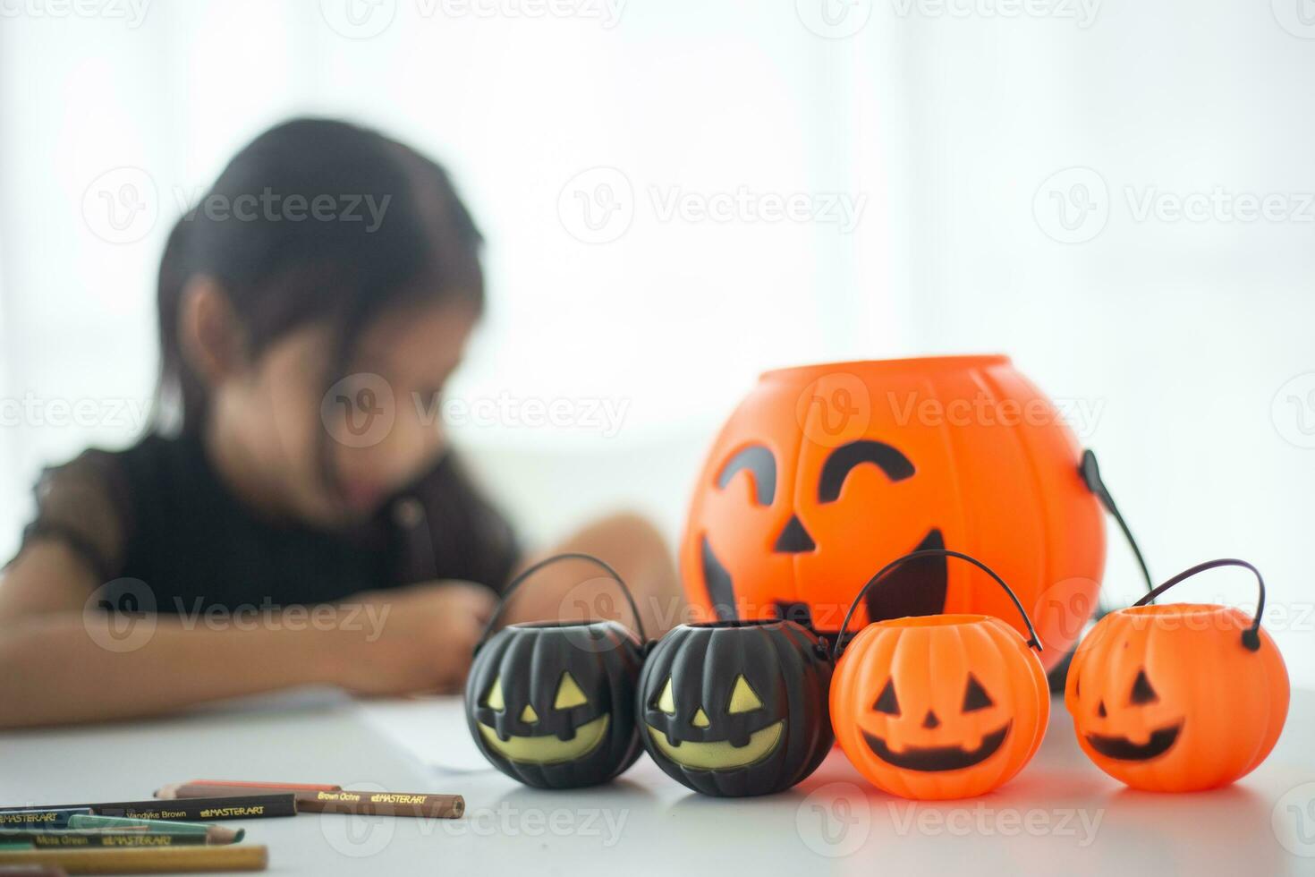 Happy Asian child girl in a witch costume to Halloween. trick or treat. Kids trick or treating. photo