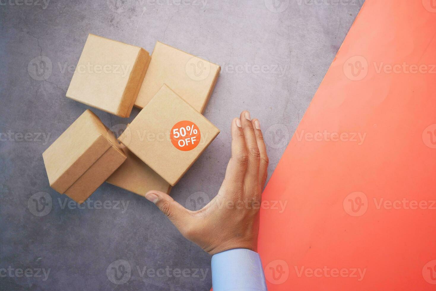 top view of 50 percent discount sign on a box on table photo