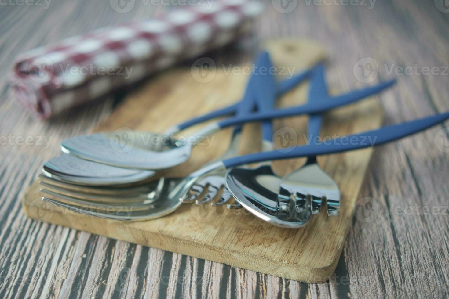 fork knife and spoon on a table cloth photo