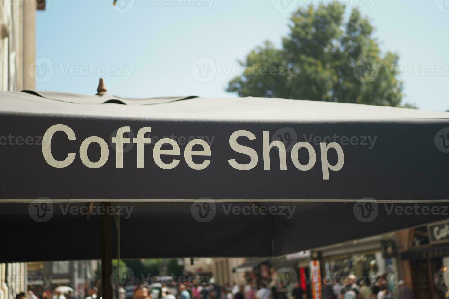 A sign at a coffee shop on a black color banner photo