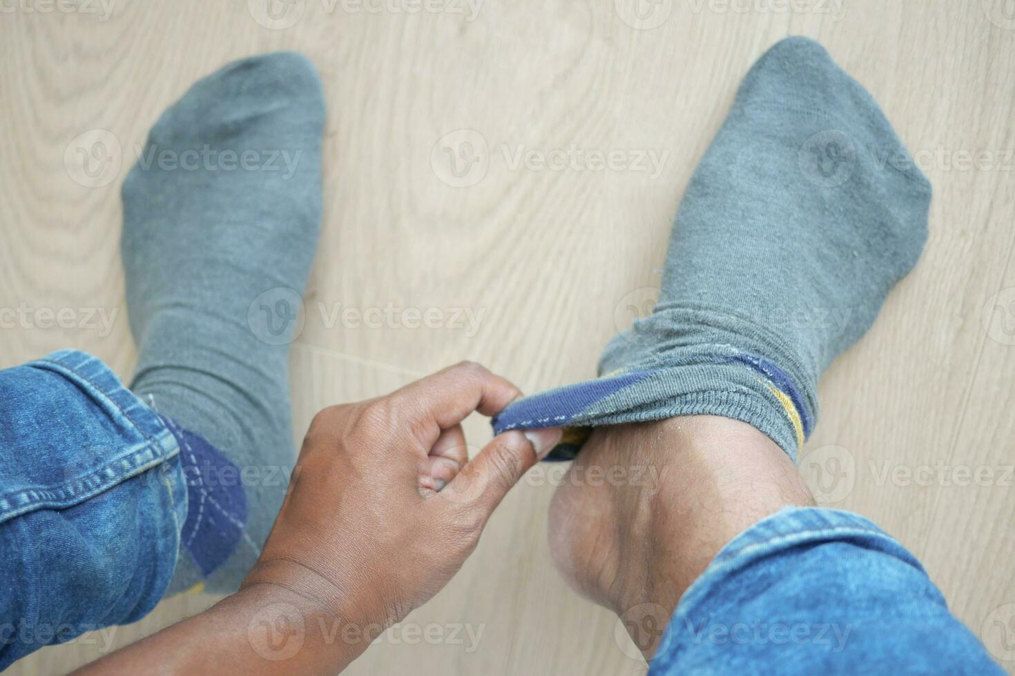 men put on gray color light socks photo