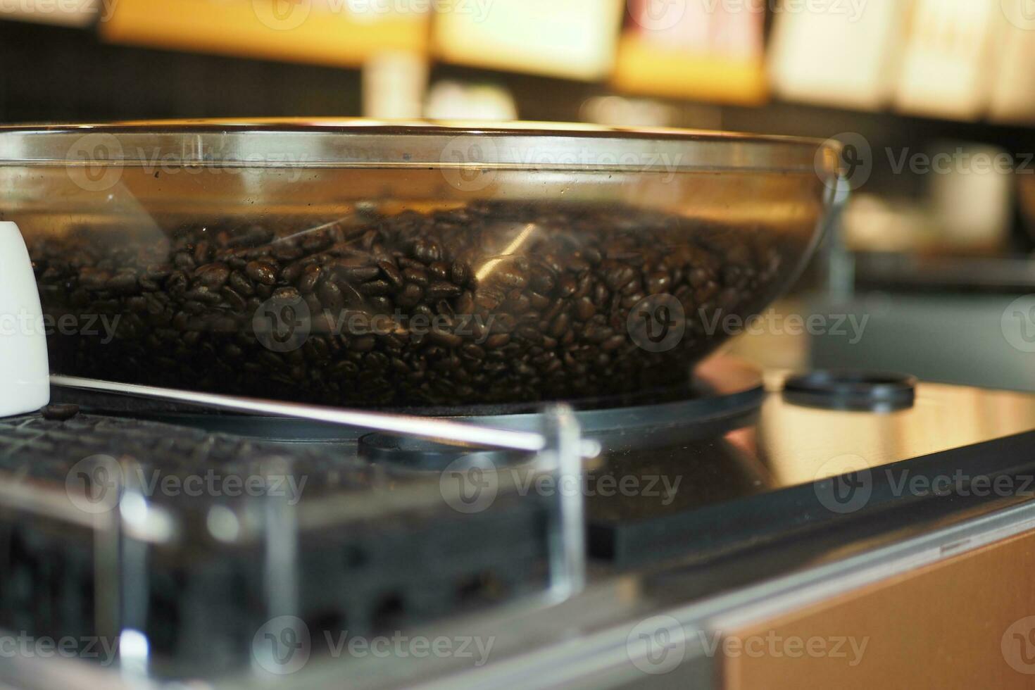 fresh coffee beans in a transparent jar at cafe photo