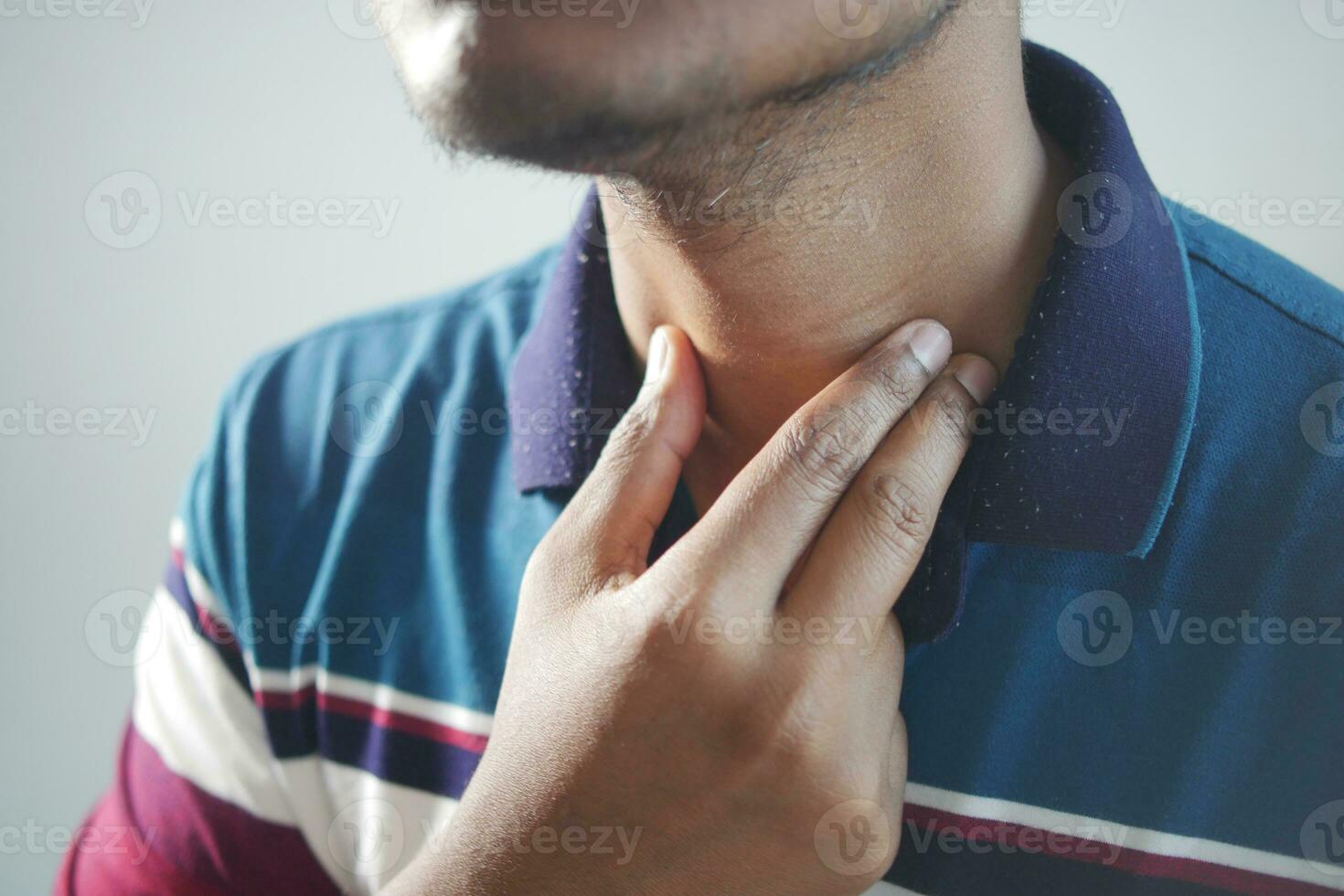 unrecognized man suffering throat pain close up photo