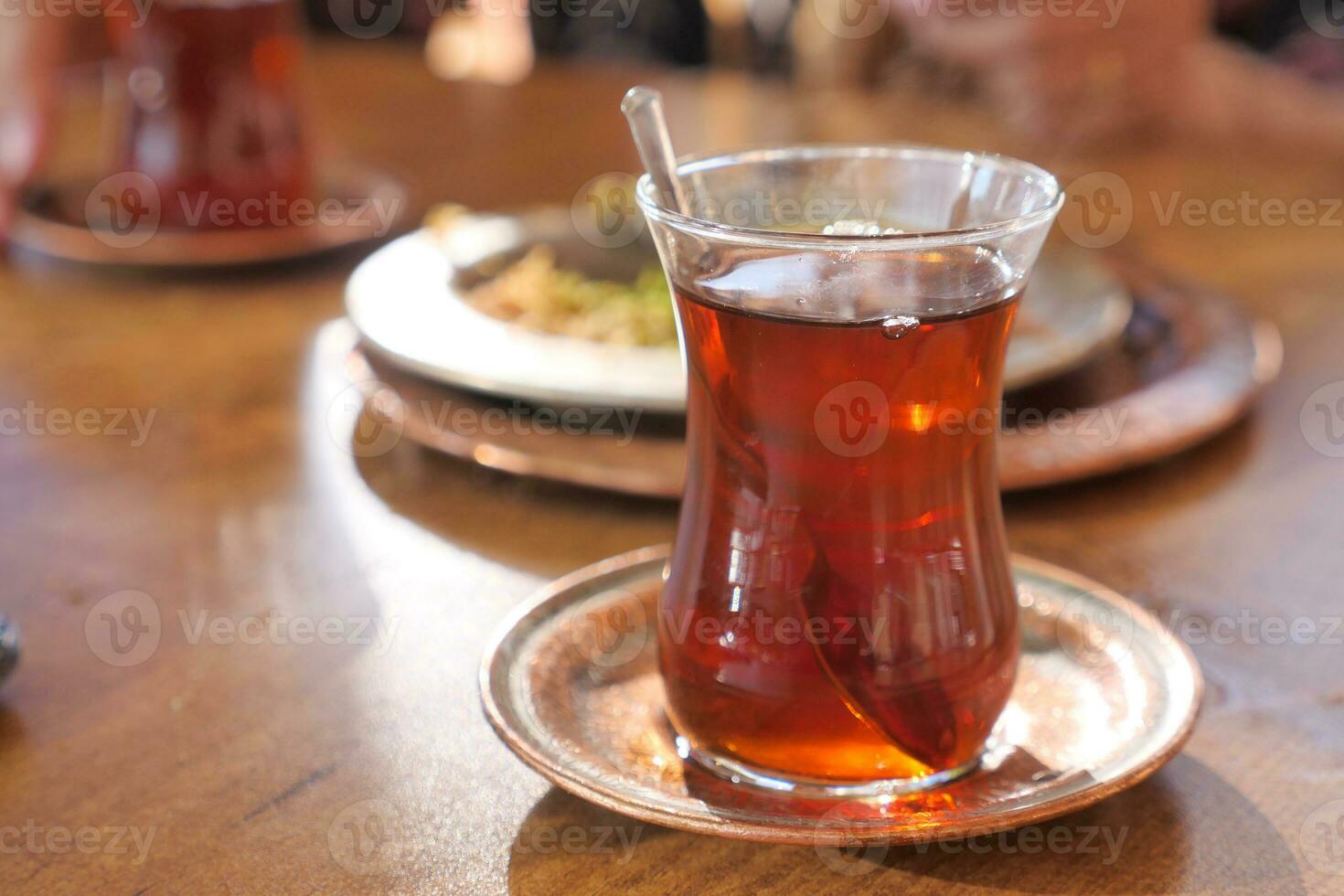 Traditional turkish tea on white table . photo