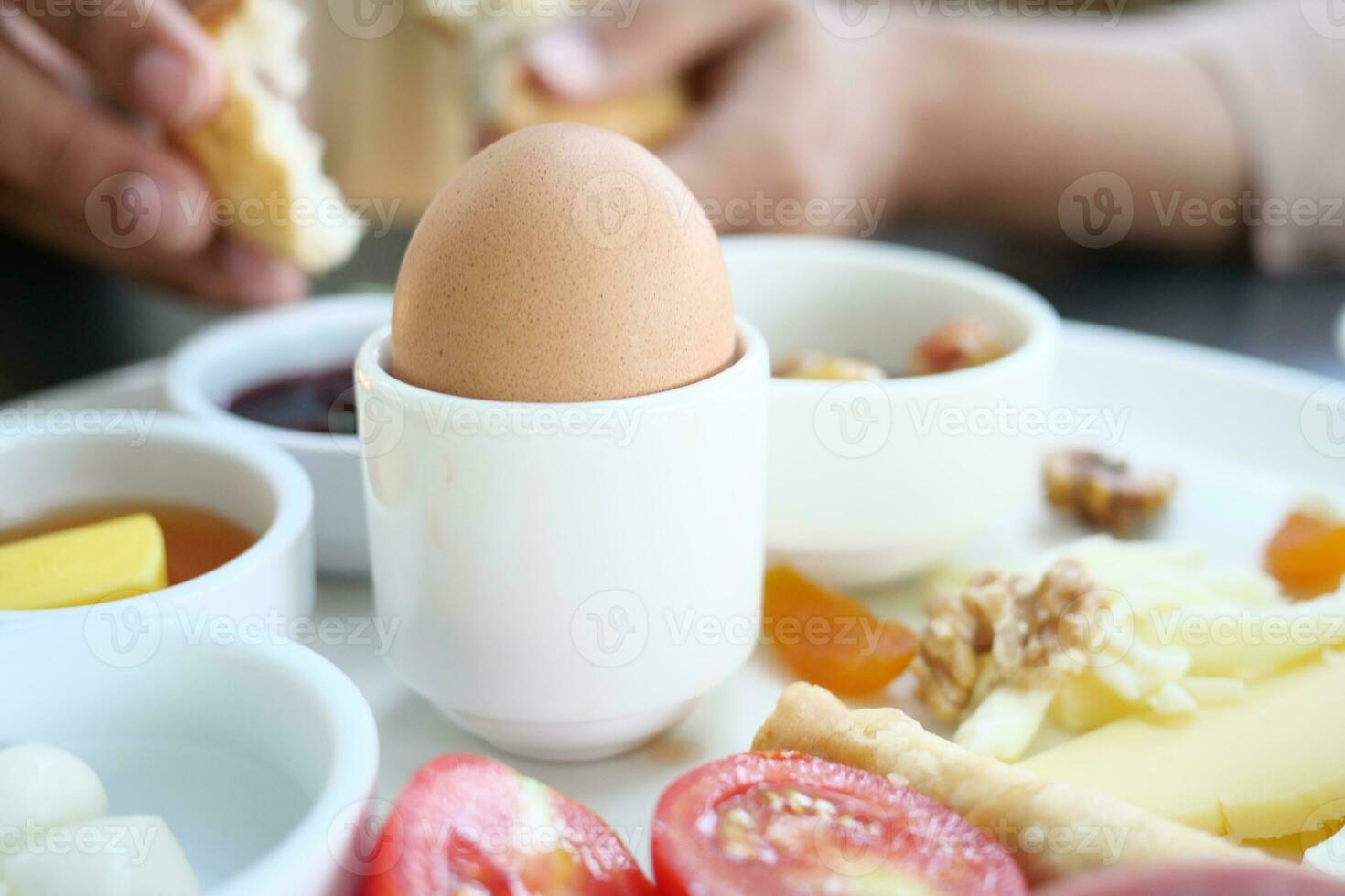 Close egg in cups for morning breakfast photo