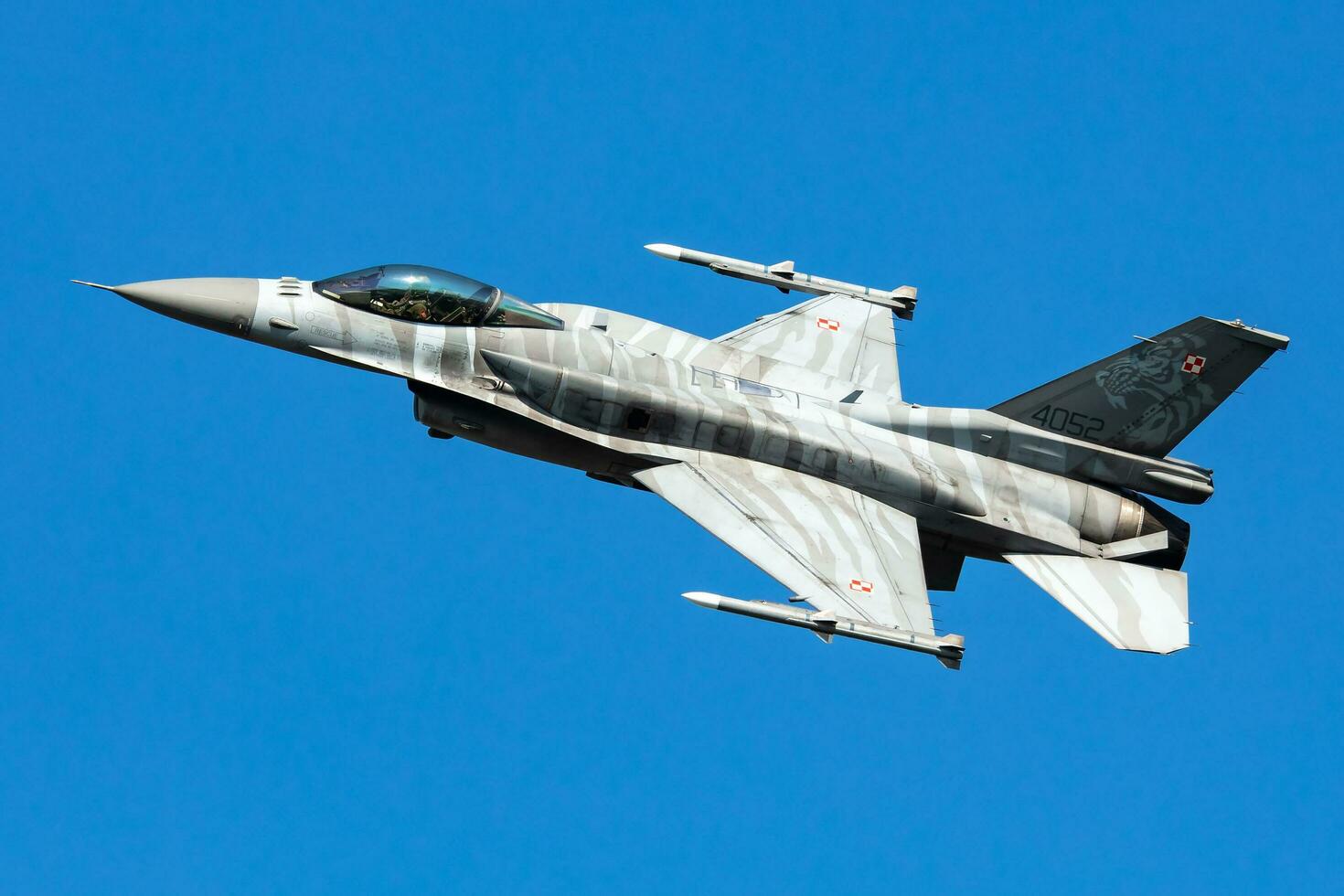 Polish Air Force Lockheed F-16 Fighting Falcon fighter jet plane flying. Aviation and military aircraft. photo