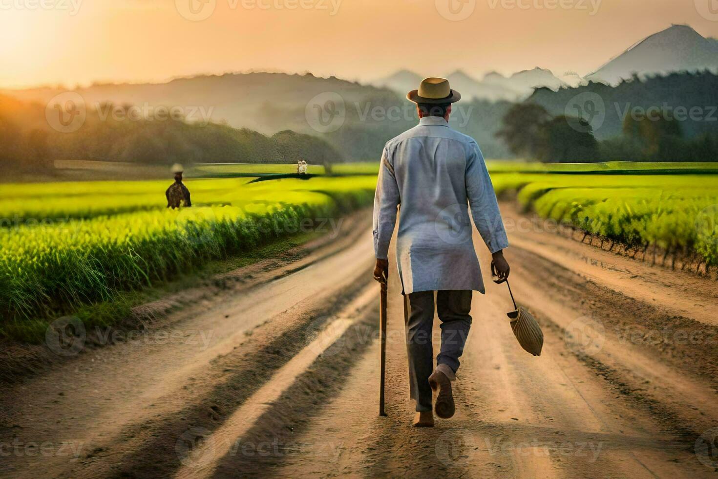 a man walking down a dirt road in a rice field. AI-Generated photo
