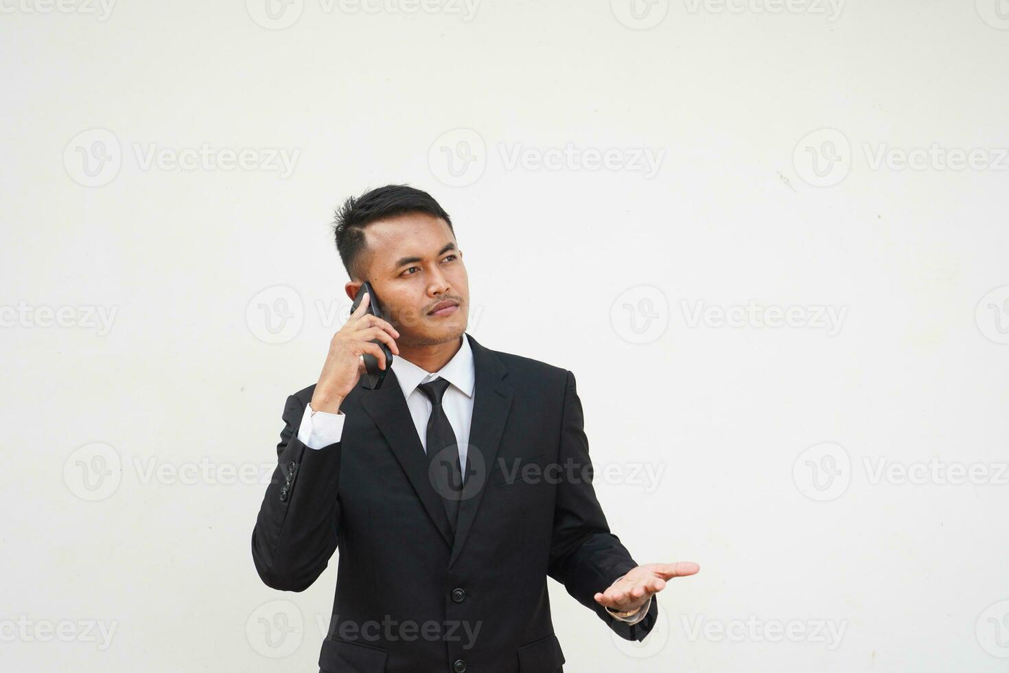 Portrait Young Asian businessman calling use mobile phone, talk about business isolated on white background photo
