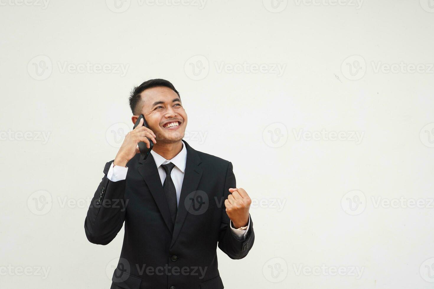 Portrait Young Asian businessman calling use mobile phone, talk about business with happy and smiling face isolated on white background photo