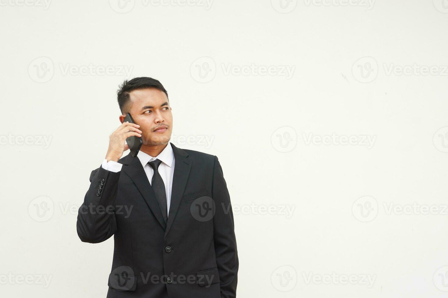 Portrait Young Asian businessman calling use mobile phone, talk about business isolated on white background photo