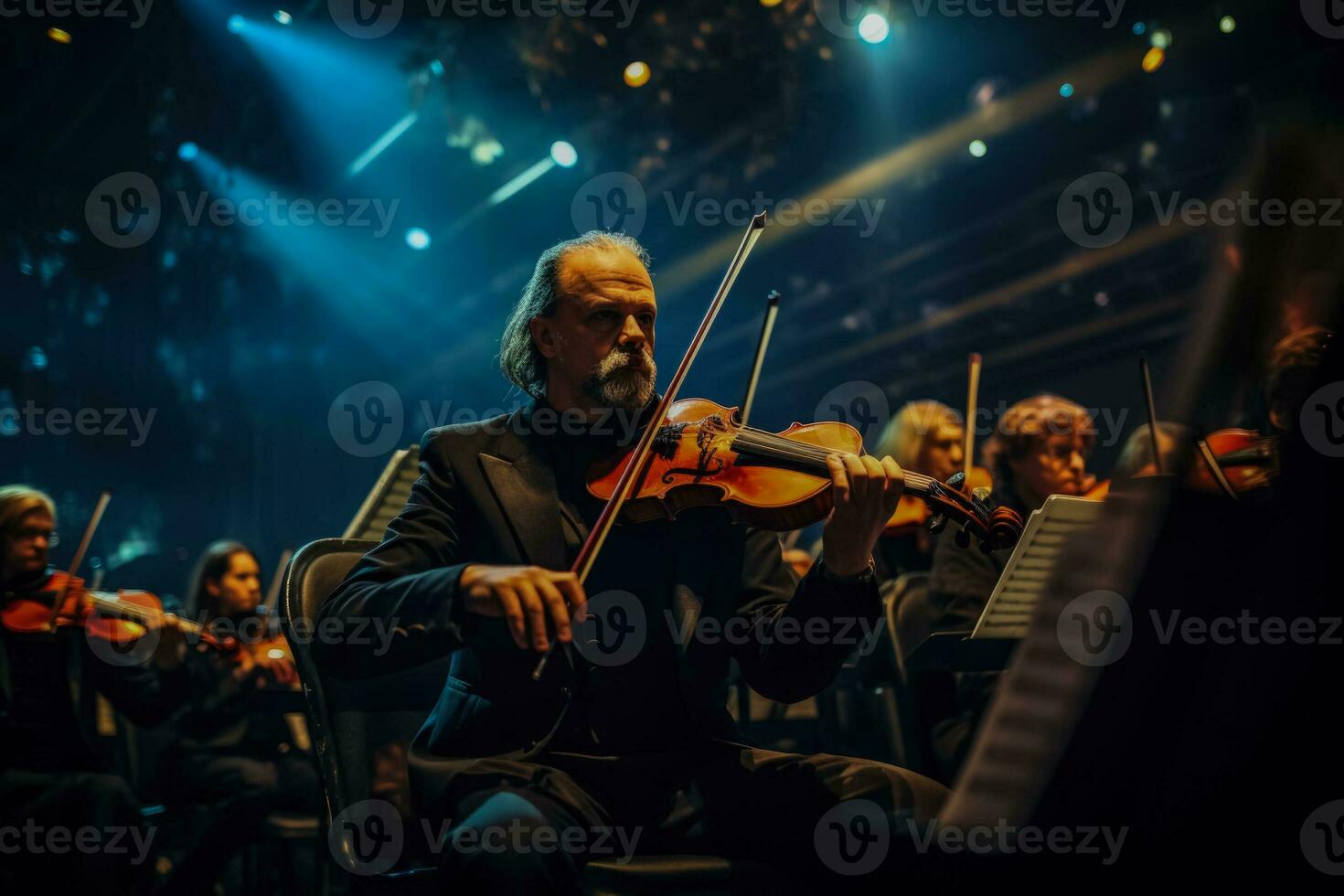 Musicians passionately playing their instruments in the theaters grand orchestra photo