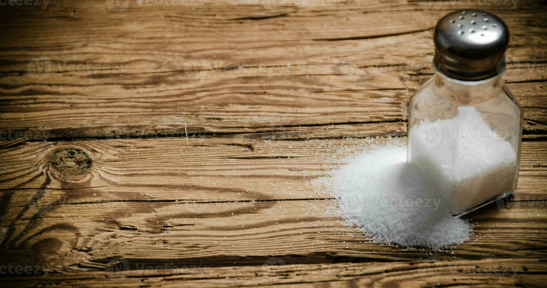 Salt background . On wooden table. photo