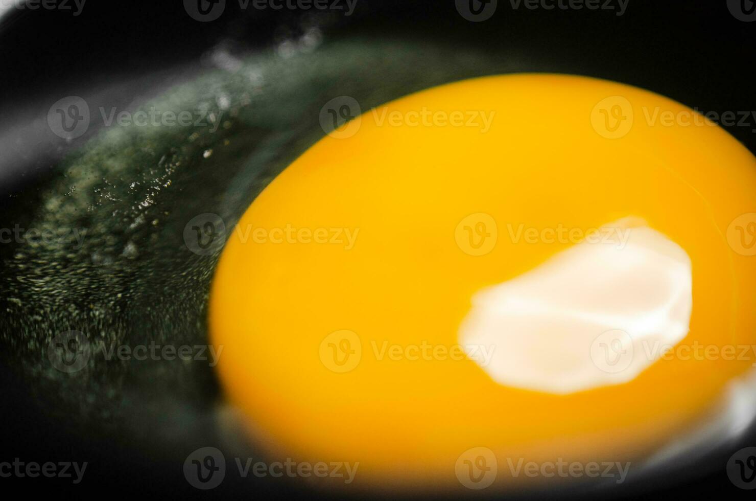 Chicken yolk from an egg in cup. photo
