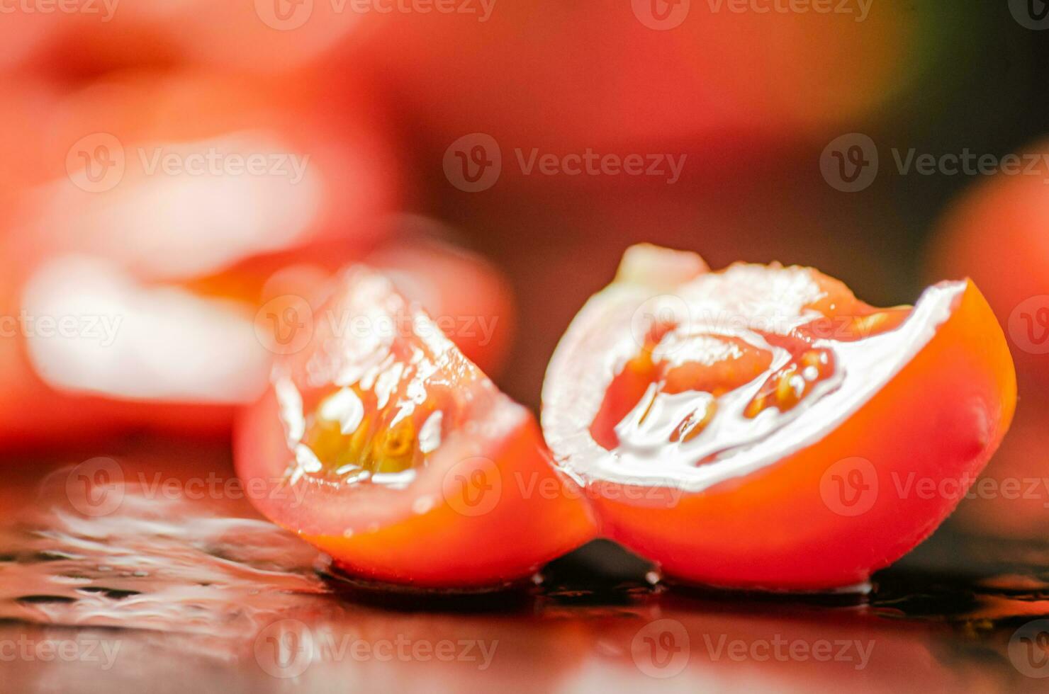 Fresh chopped tomatoes. On black table. photo