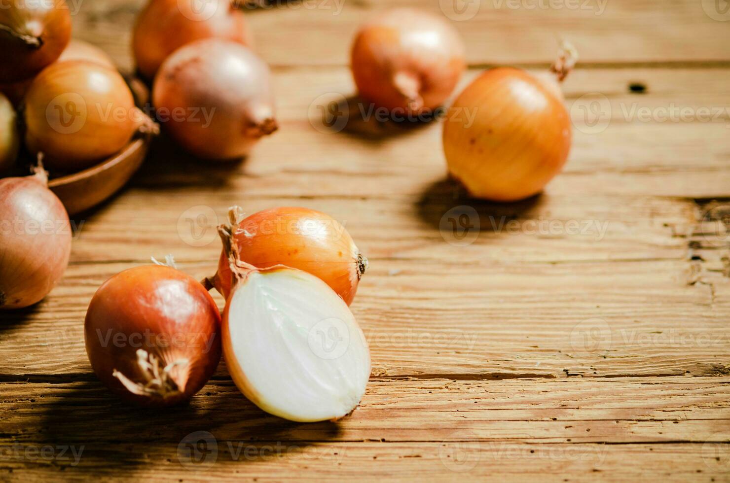 Fresh onions on table . photo