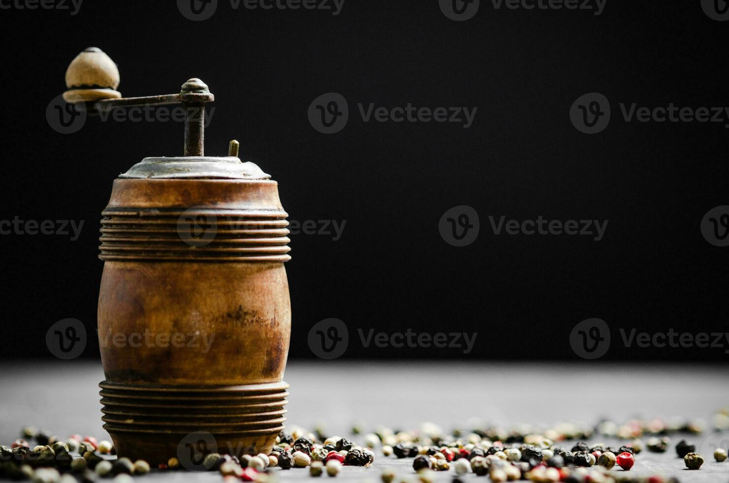 Peppercorn on rustic background. photo