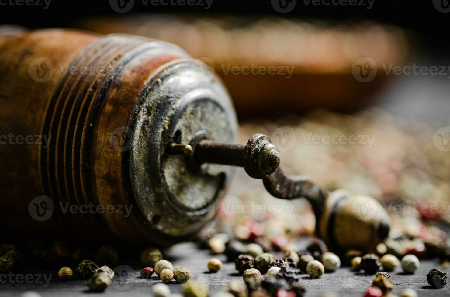 Peppercorn on rustic background. photo