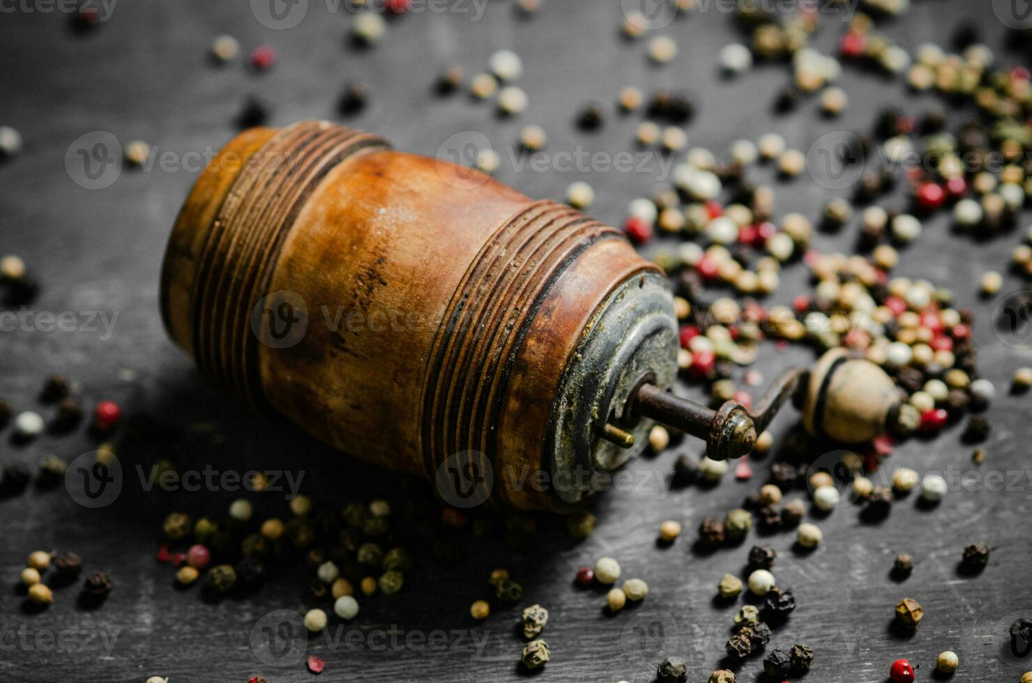 Peppercorn on rustic background. photo